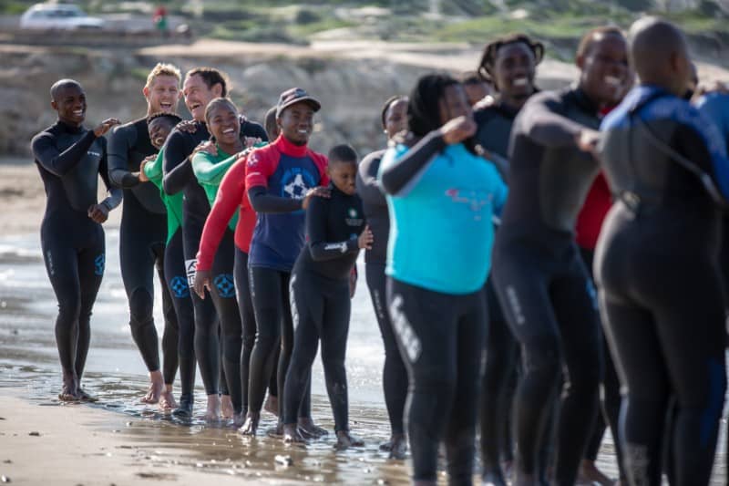 3 x World Champ Mick Fanning & Taylor Knox visit one of W4C's new Surfing & Autism Programmes